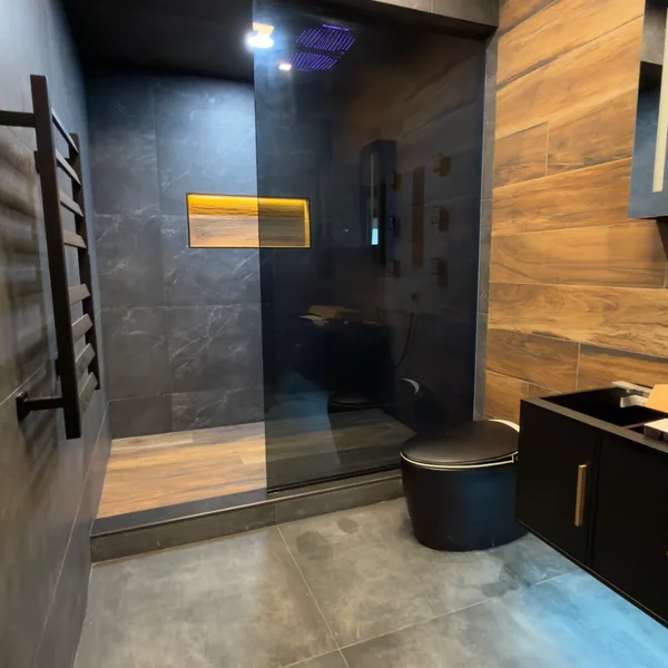 Modern bathroom with large-format tile and LED rain shower, Fairfield County CT