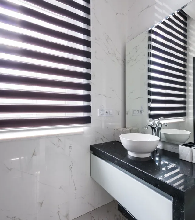 Cross Tiles craftsman setting large-format tile with a precise mitered edge