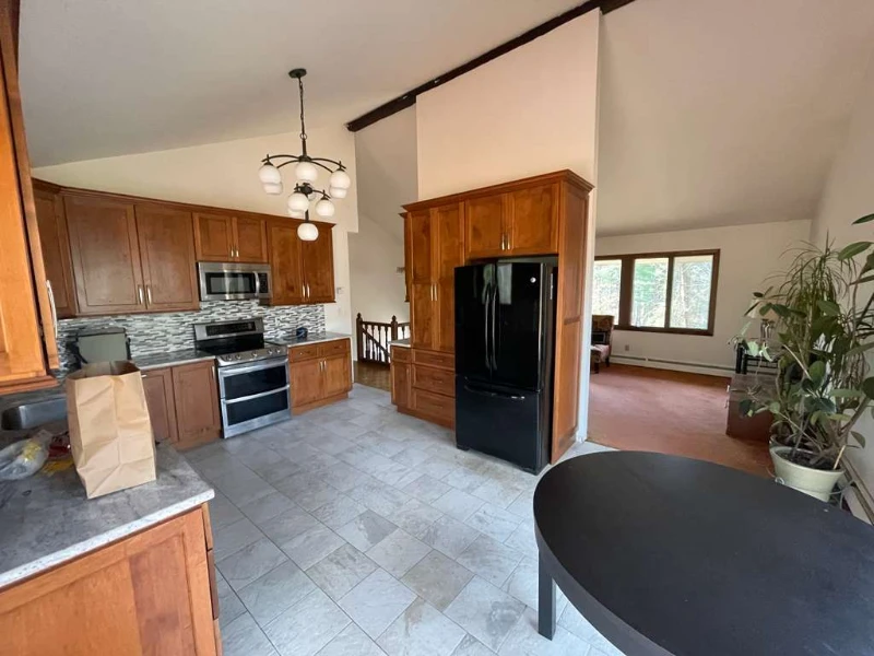 Dated Fairfield County, CT kitchen with brown cabinets before a Cross Tiles remodel
