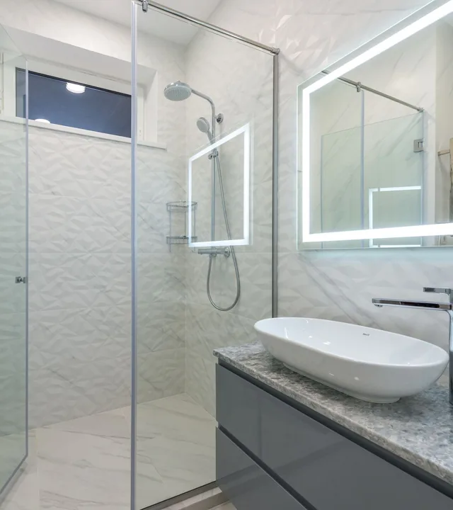 Barrier-free curbless shower with seamless tile entry and linear drain